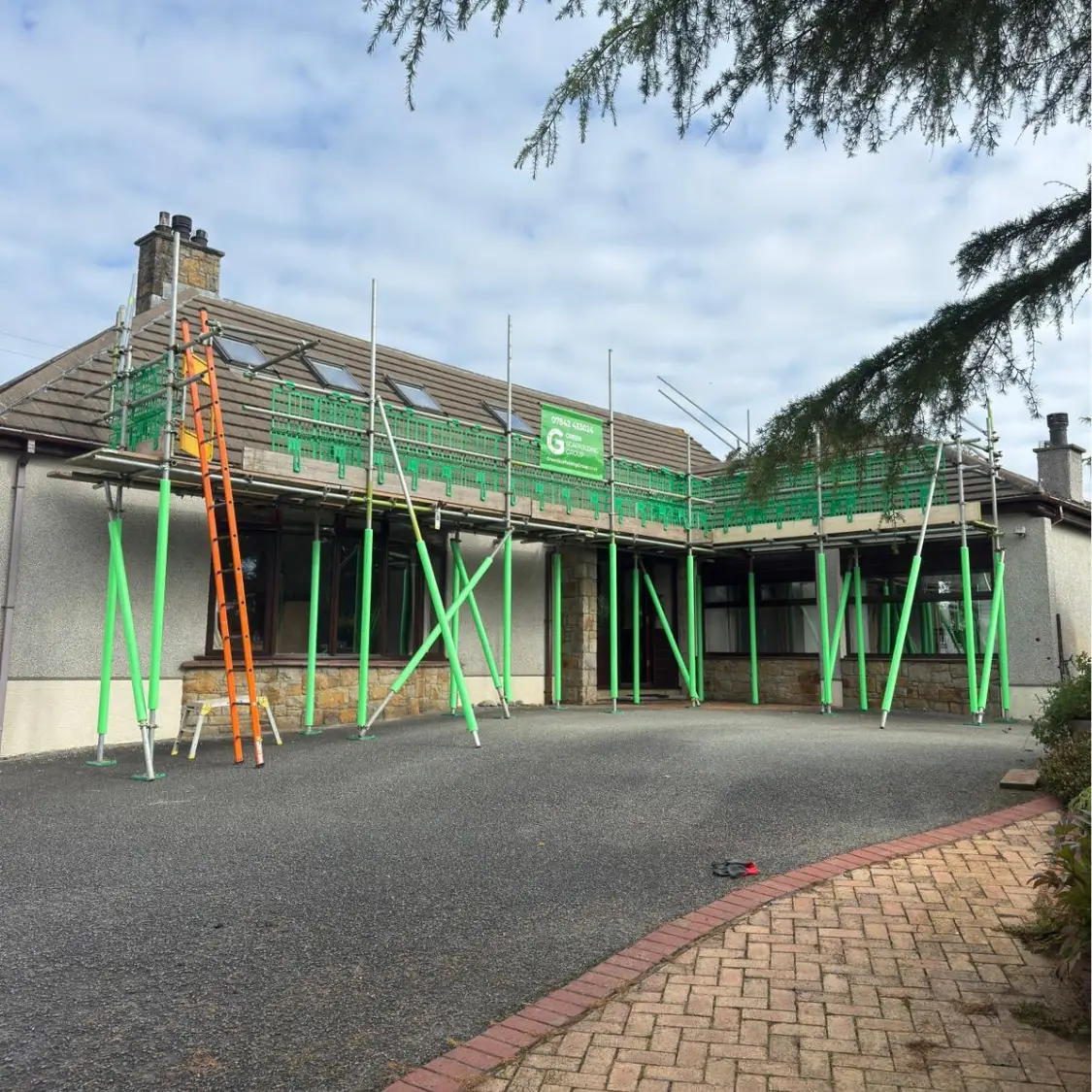 Green Scaffolding Group roof access scaffolding installed on a rural stone property