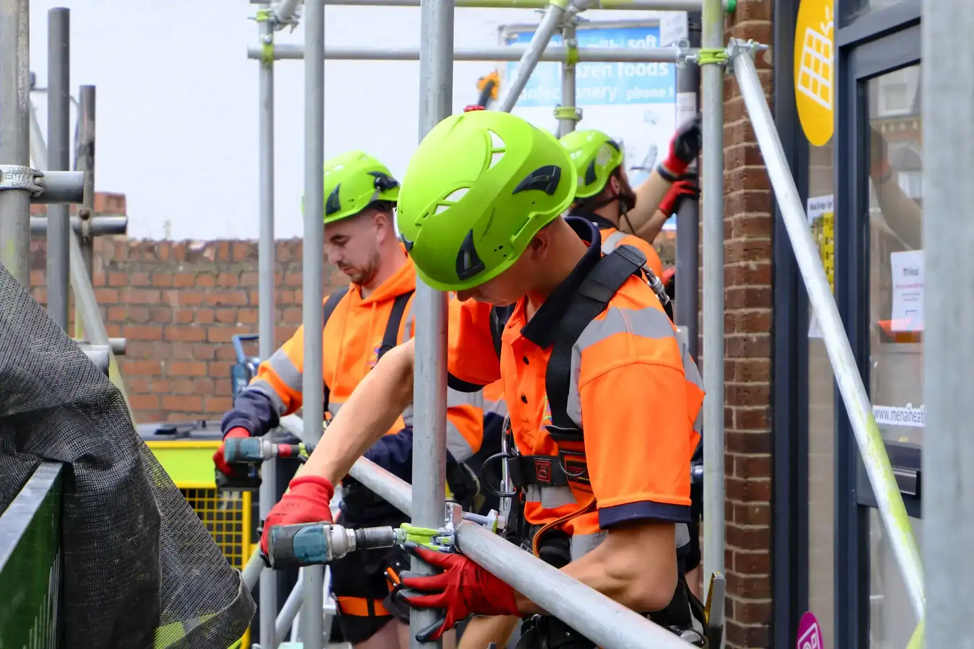 Green Scaffolding Group team erecting scaffolding in Menai Bridge